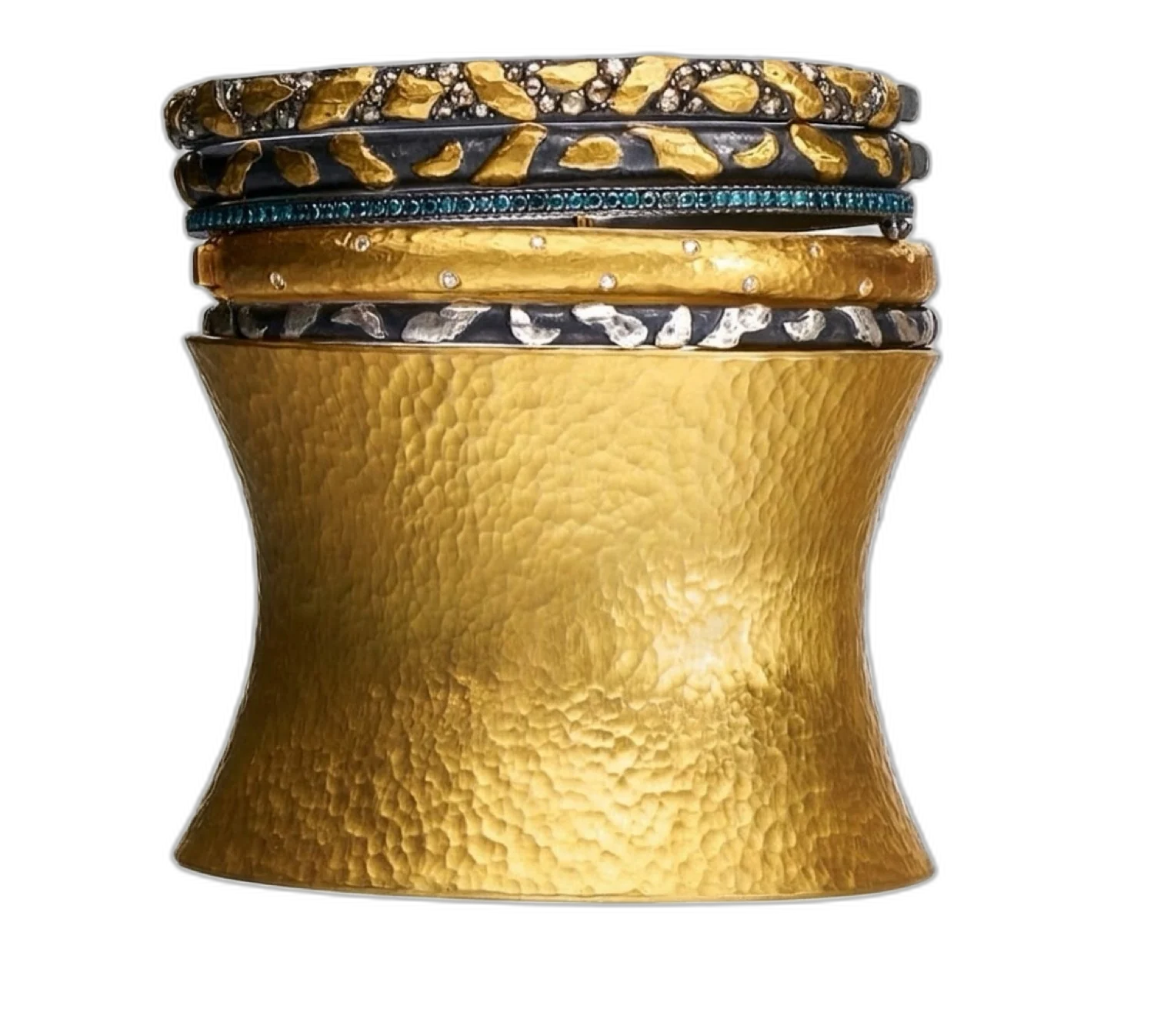 Stack of Yossi Harari gold bracelets